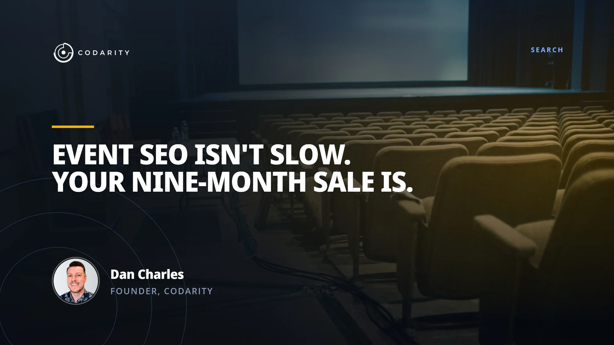 A darkened conference auditorium of empty seats facing a lit stage screen, captioned 'Event SEO isn't slow. Your nine-month sale is.' — with Dan Charles, Founder of Codarity
